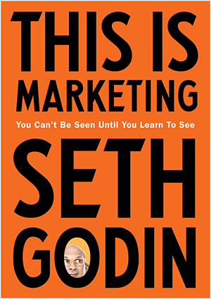 Ovo je snimka zaslona naslovnice časopisa This Is Marketing, autora Seth Godin. Naslovnica je okomiti pravokutnik s narančastom pozadinom i crnim tekstom. Fotografija Sethove glave pojavljuje se u O njegovog prezimena.